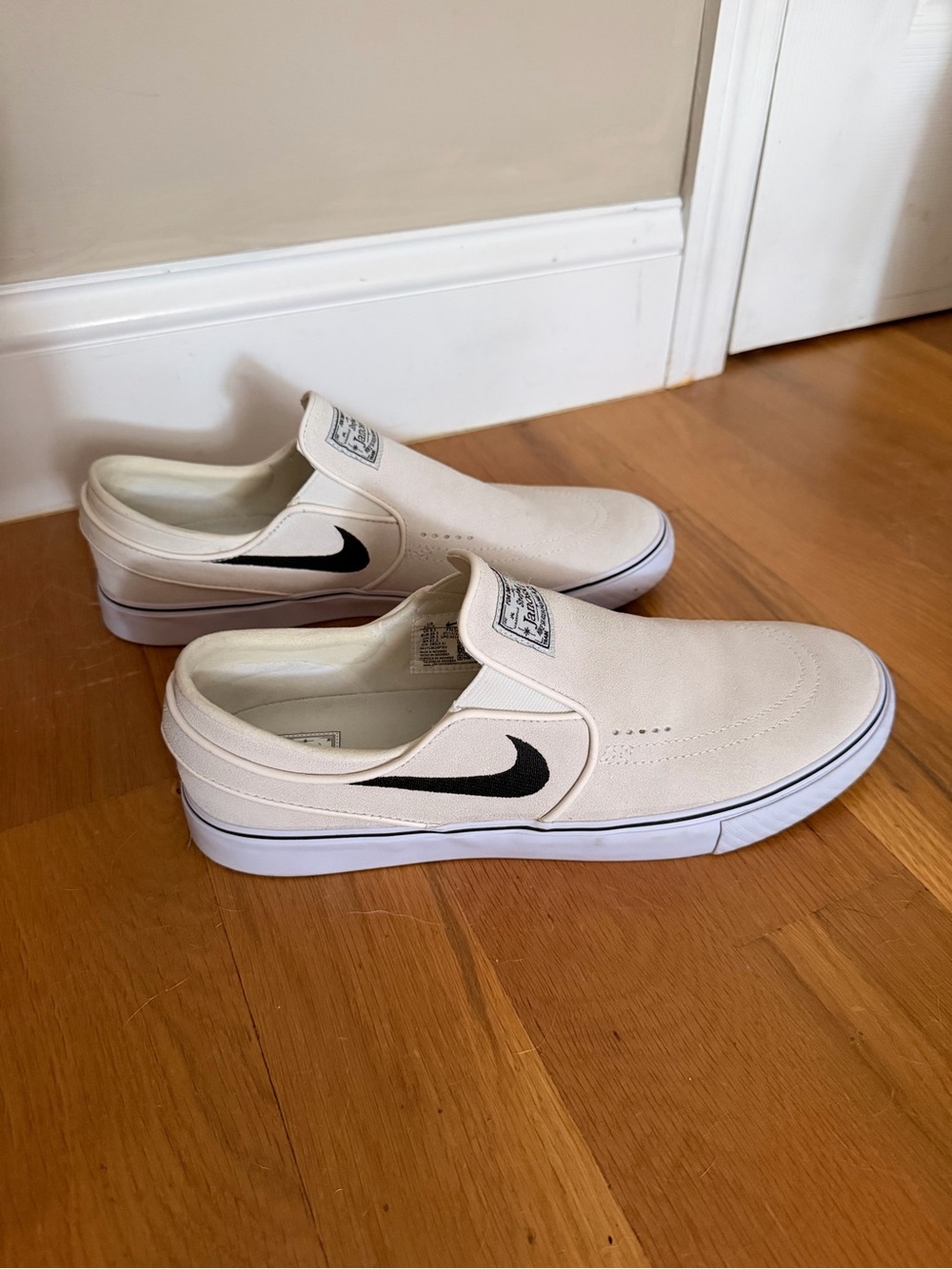 Nike Men’s Slip-On Sneakers in Off-White with Black Swoosh